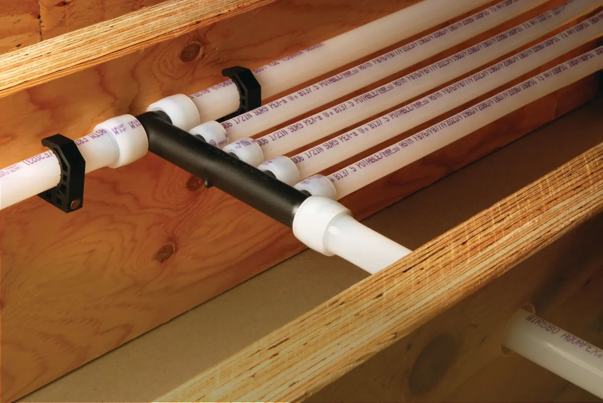 PEX-A multiport tee distributing water lines along joists – Switching to Tankless for Mission Viejo, CA homes